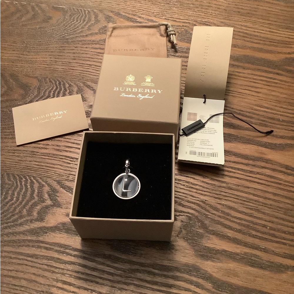 Burberry Women's Round Silver-Tone Charm Pendant in Grey